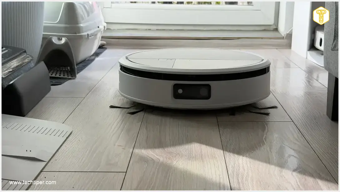 Image showing iRobot Roomba Max 775 Combo Robot Vacuum Cleaning in Modern Home